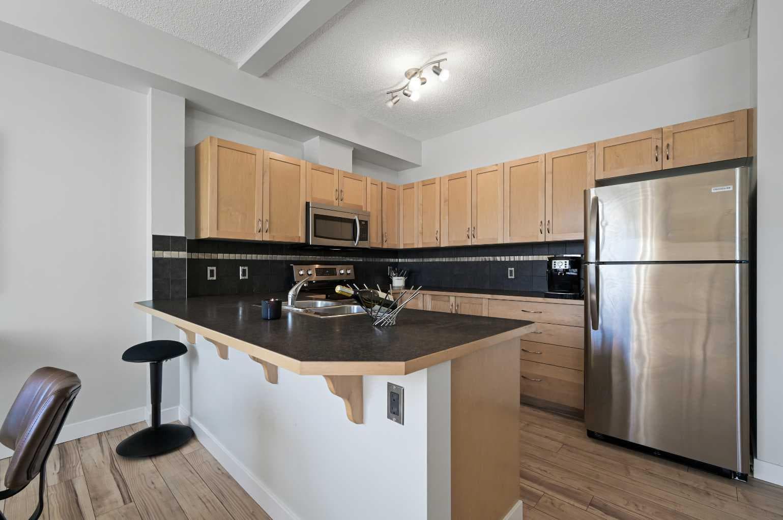 2205, 211 Aspen Stone Boulevard SW