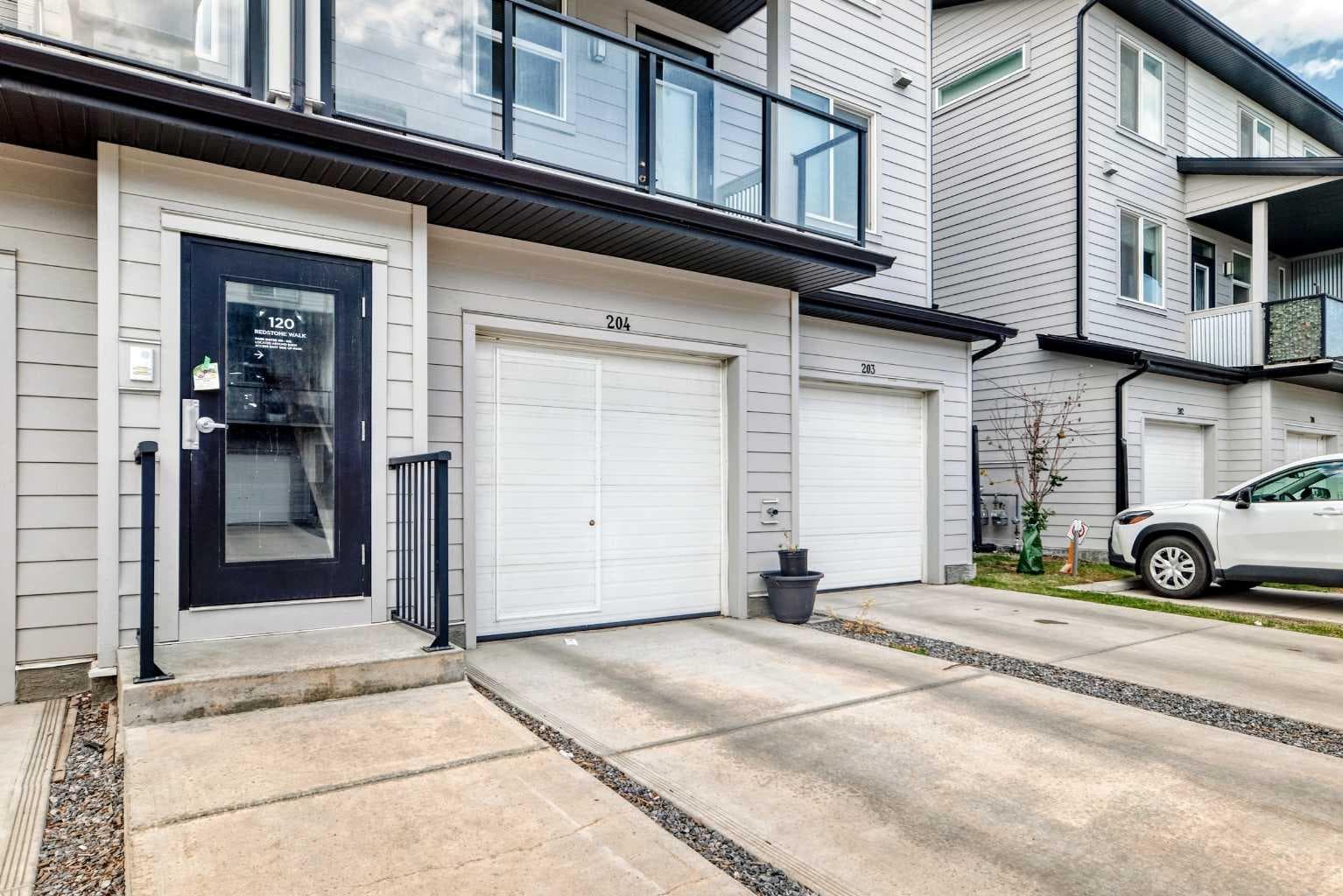 203, 120 Redstone Walk NE
